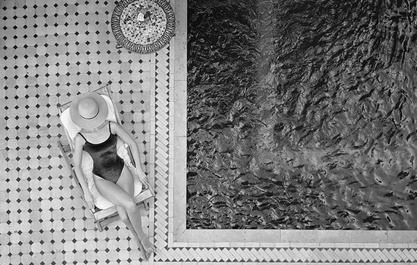 Crafted Collection Hotels Woman Resting at Pool